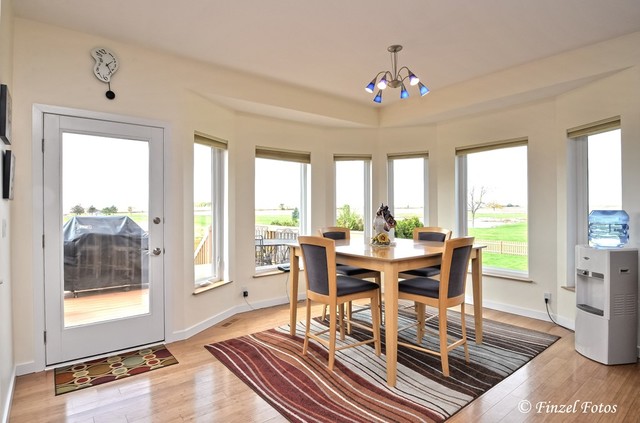 30813 Lincoln Road Genoa, IL 60135 - Photo 9 of 20 a view of a dining room with furniture wooden floor and a chandelier