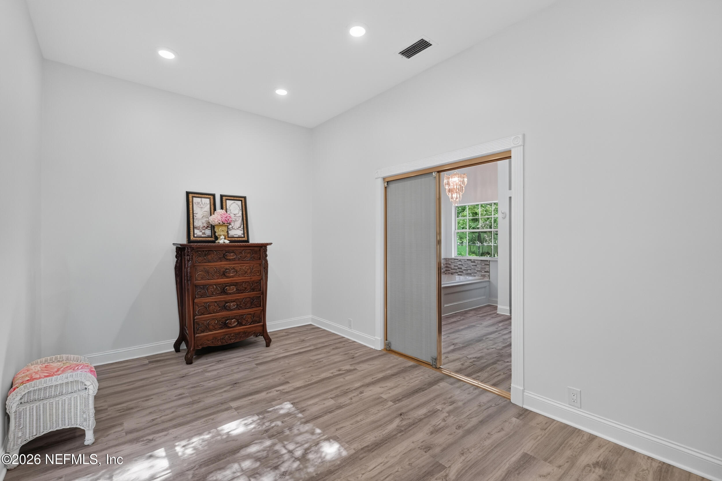 3090 Monument Bay Road St. Augustine, FL 32092 - Photo 31 of 56 an empty room with furniture and wooden floor