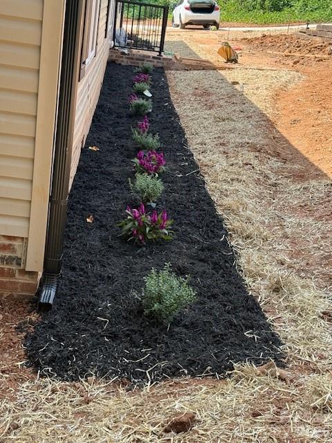 178 Clear Springs Road Mooresville, NC 28115 - Photo 12 of 13 a view of a pathway with a flower garden