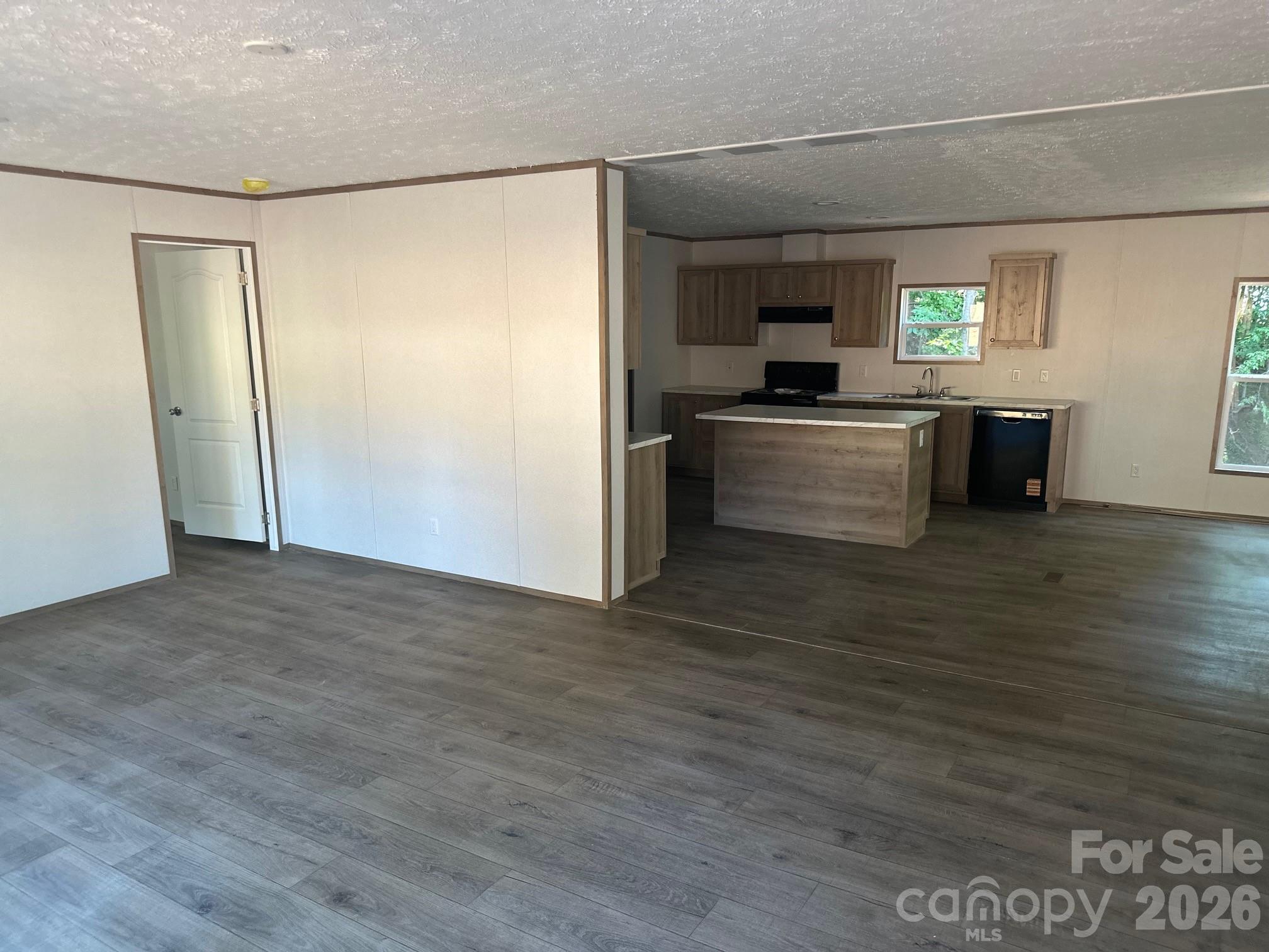 178 Clear Springs Road Mooresville, NC 28115 - Photo 3 of 13 a kitchen with granite countertop a refrigerator and a stove top oven