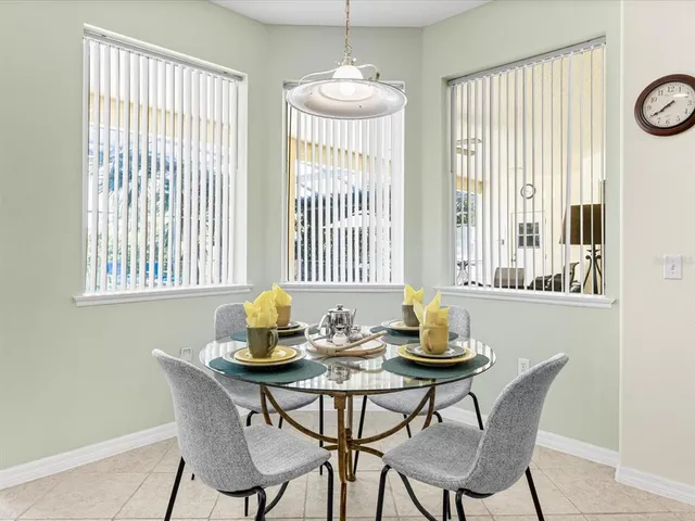 a dining room with furniture and windows