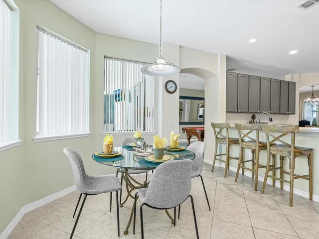 a dining room with furniture and window