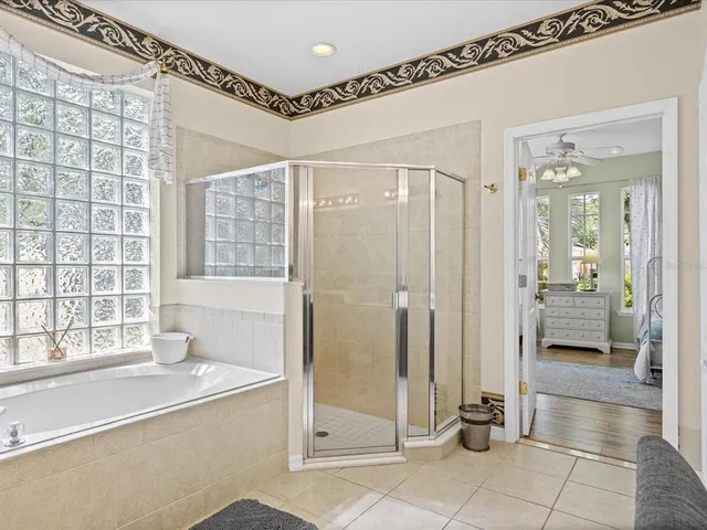 a bathroom with a shower and a sink