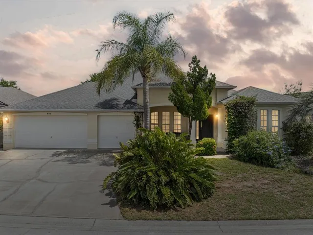 a front view of house with yard and green space