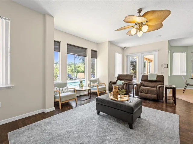 a living room with furniture and a large window