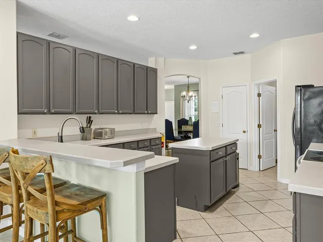 a kitchen with stainless steel appliances granite countertop a sink counter space and cabinets
