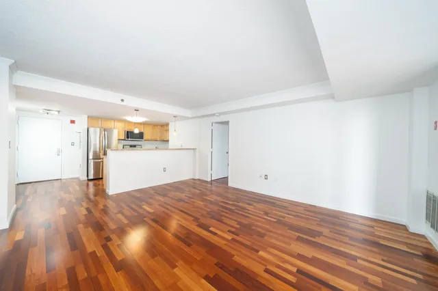 a view of a kitchen with wooden floor