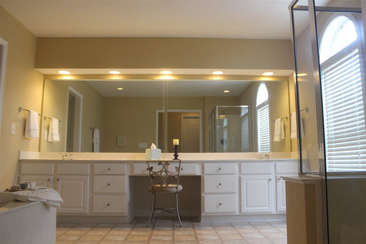 7514 Silver View Lane Raleigh, NC 27613 - Photo 19 of 25 No fighting over counter space in this fantastic master bath! Plenty of cabinet space and a linen closet as well. Master Bath