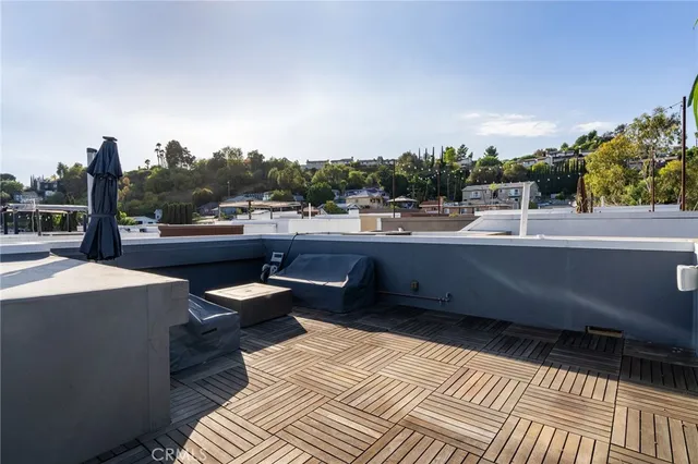 a view of a balcony with furniture