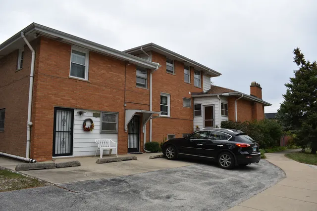 a car parked in front of a house