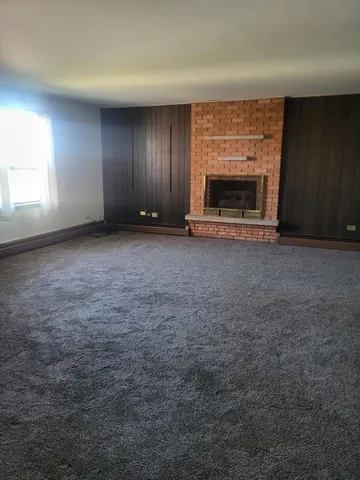 an empty room with a fireplace