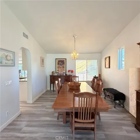 a kitchen with a sink a counter top space stainless steel appliances and windows