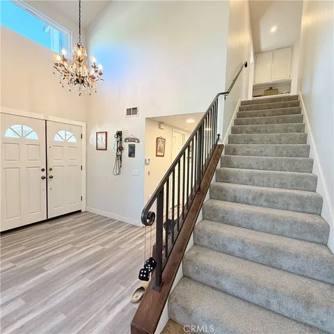 a bed room with furniture and a chandelier