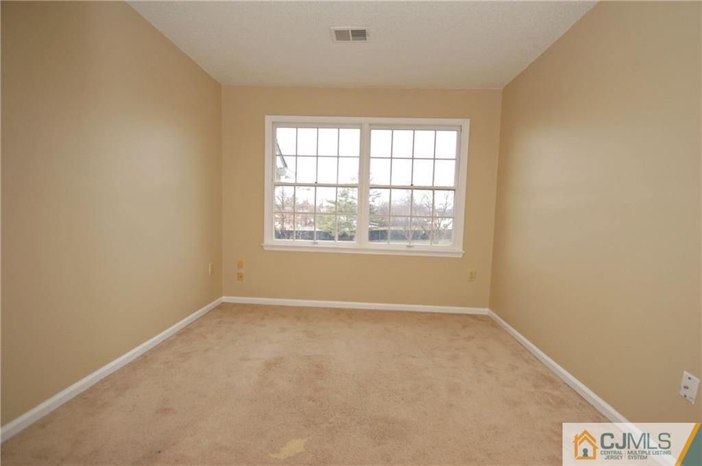 1037 Edpas Road, Unit 1037 New Brunswick, NJ 08901 - Photo 12 of 15 an empty room with a window