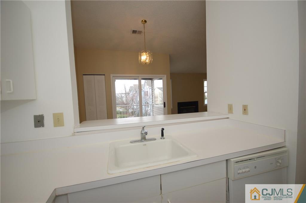 1037 Edpas Road, Unit 1037 New Brunswick, NJ 08901 - Photo 9 of 15 a bathroom with a sink and a large mirror