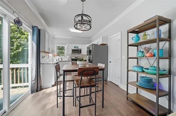 a view of a dining room with furniture window and outside view