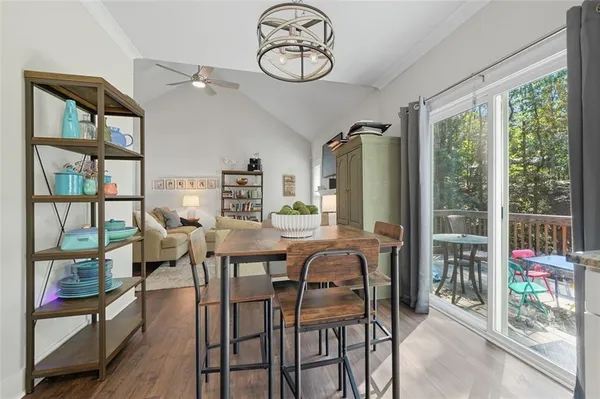 a dining room with furniture water view and large window