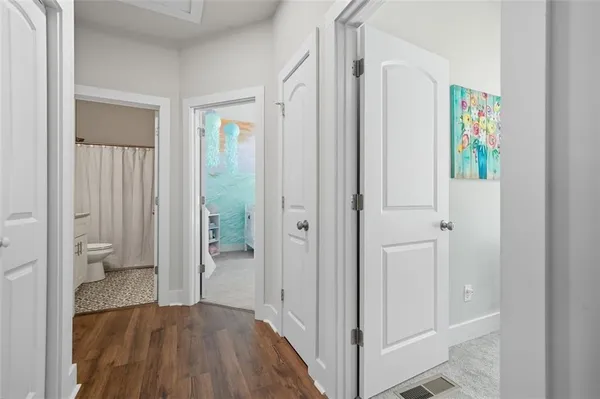 a view of a bedroom from a hallway