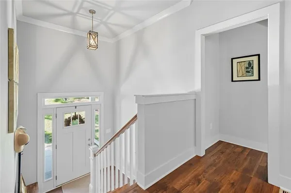 a view of a hallway with a bedroom