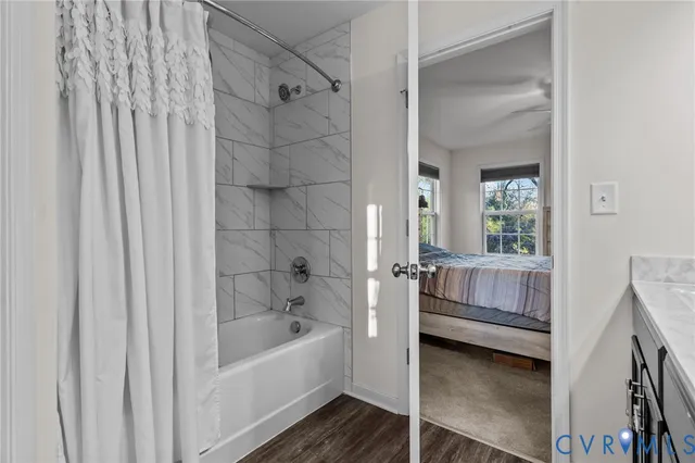 a bathroom with a tub and sink