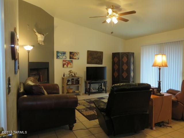 963 Calle Amarillo Rio Rico, AZ 85648 - Photo 25 of 31 a living room with furniture and a fireplace