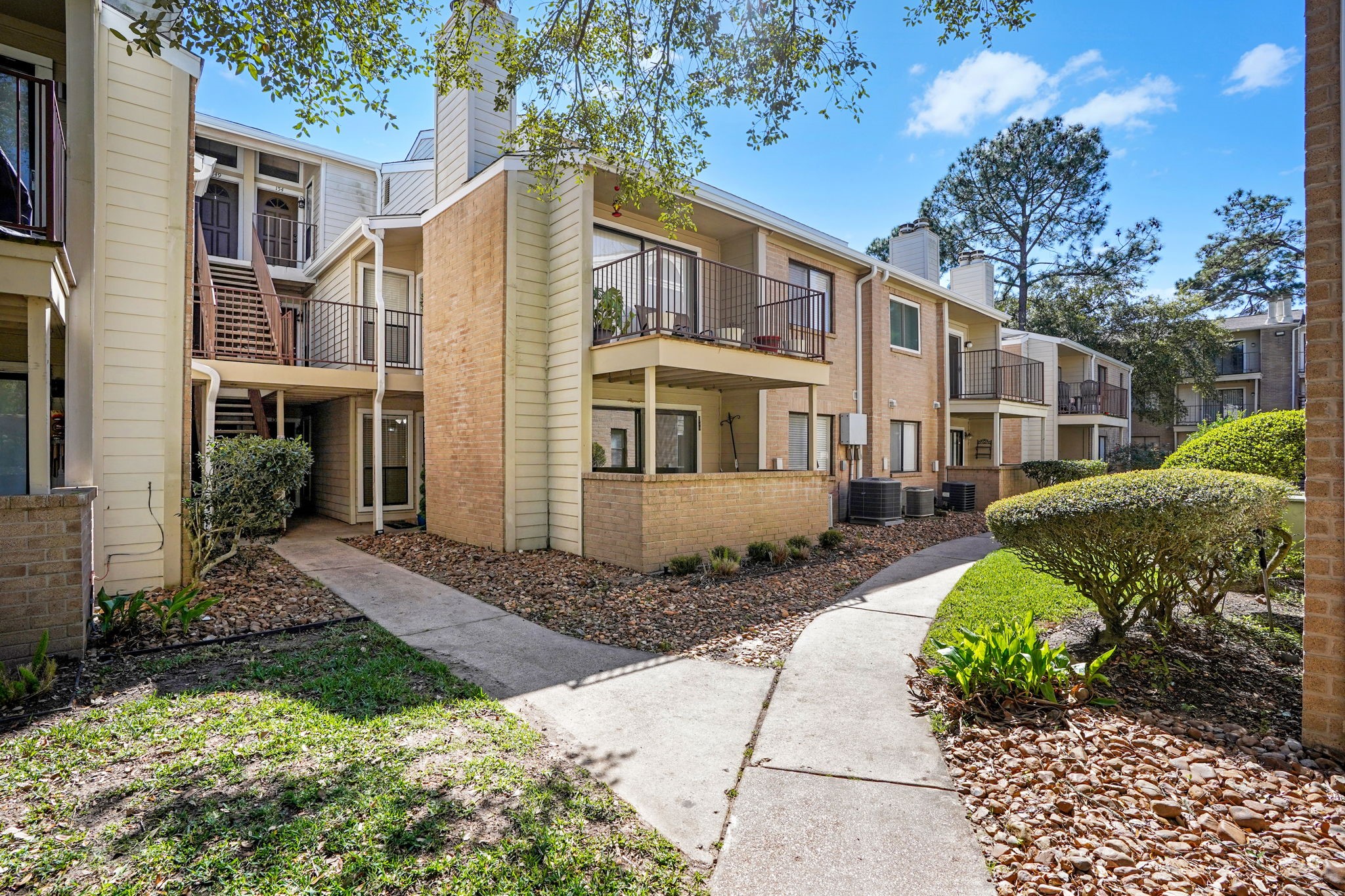 3500 Tangle Brush Drive, Unit 150 Spring, TX 77381 - Photo 17 of 23 Unit 150 enjoys a more private setting, with the family room and patio not facing the parking lot or another unit.