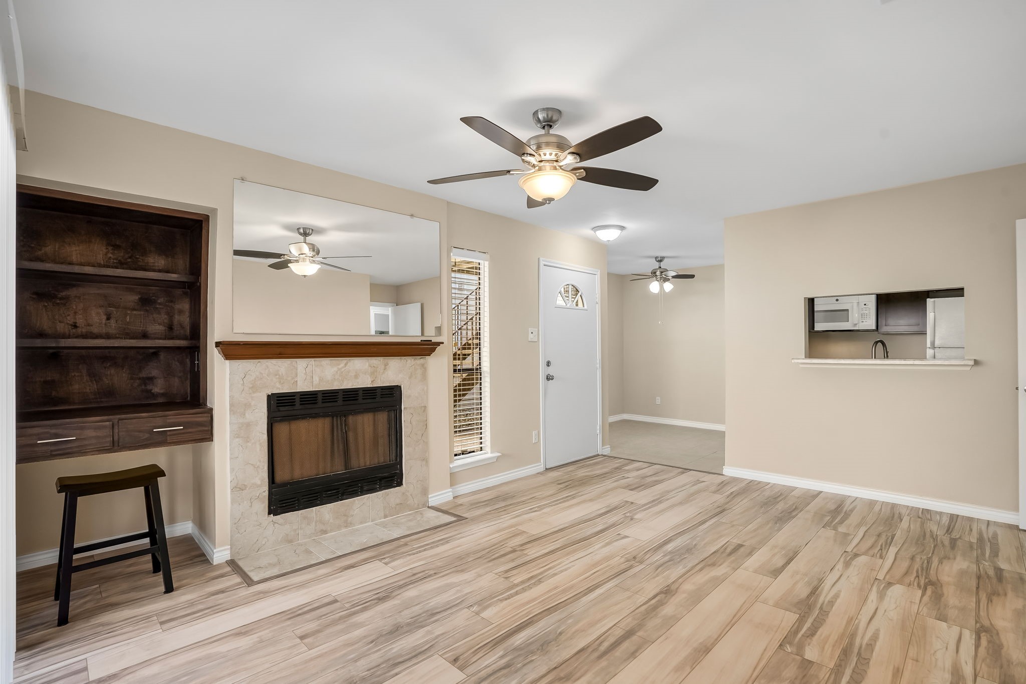 3500 Tangle Brush Drive, Unit 150 Spring, TX 77381 - Photo 2 of 23 Beautiful NEW 12mm laminate flooring in neutral tones runs throughout the unit, complementing any décor. A convenient desk nook provides the perfect work-from-home spot.