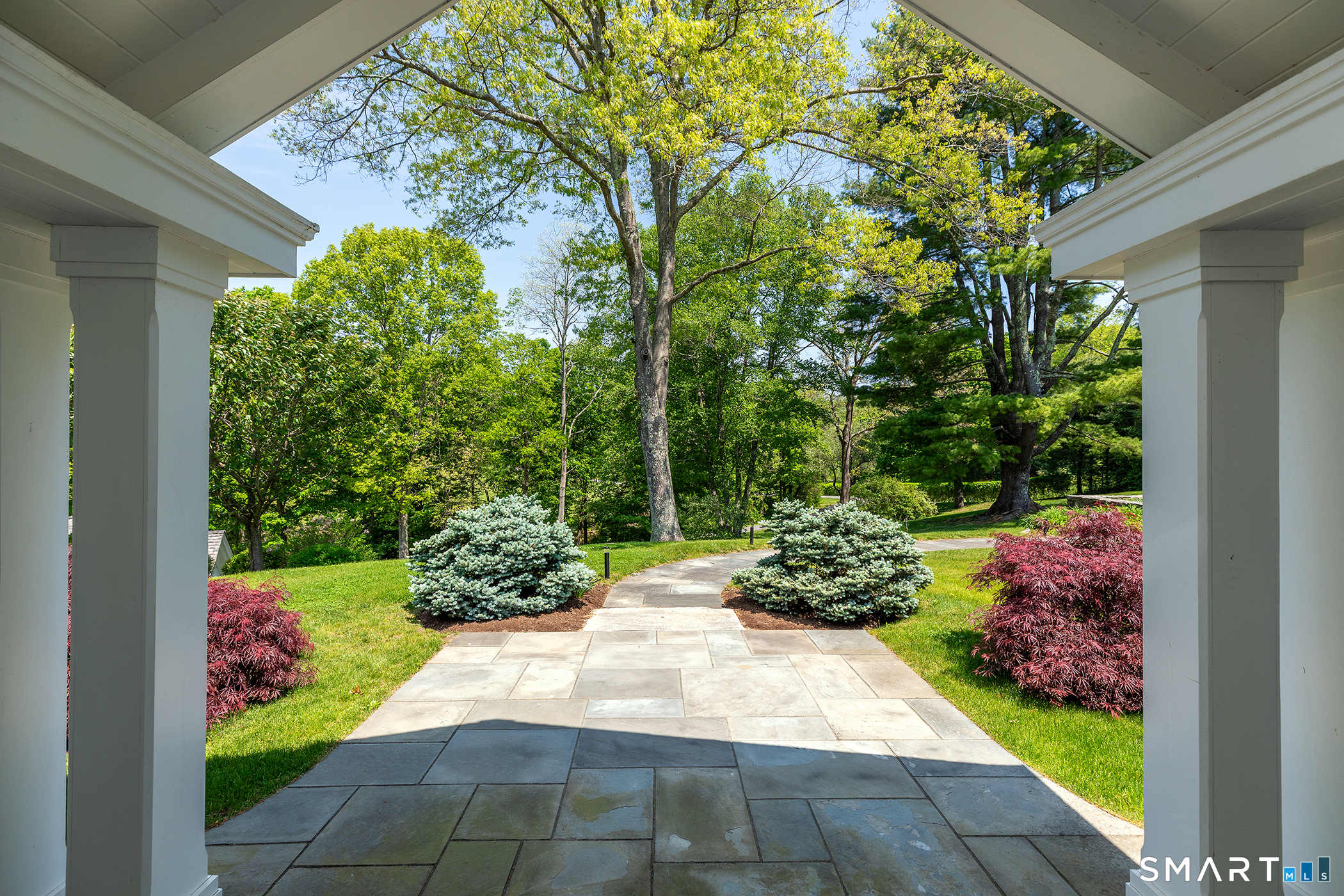 47 Squire Road Roxbury, CT 06783 - Photo 22 of 27 a view of a back yard with flower plants
