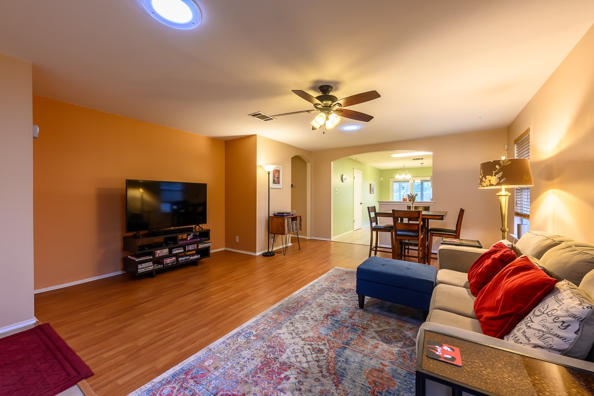 8920 Frock Court Austin, TX 78748 - Photo 2 of 22 a living room with furniture and a flat screen tv
