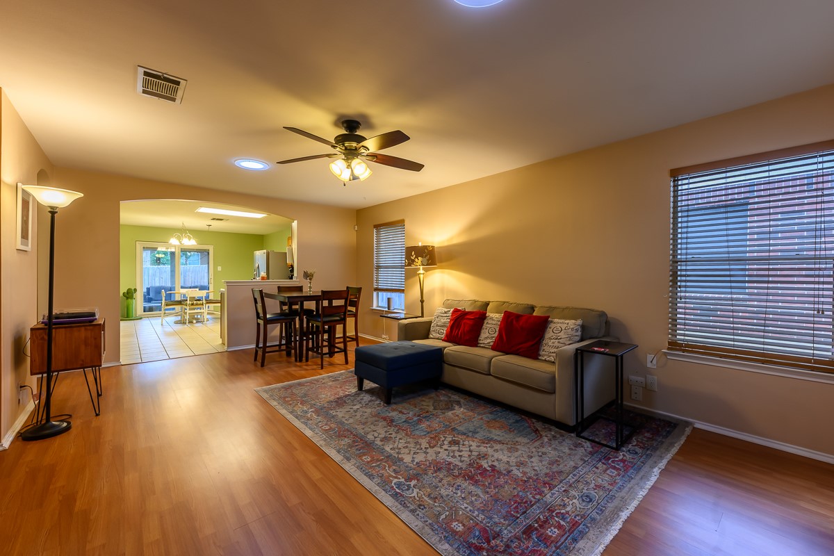 8920 Frock Court Austin, TX 78748 - Photo 3 of 22 a living room with furniture and a wooden floor