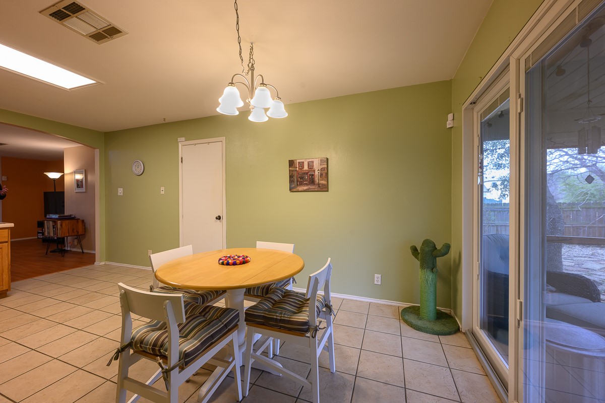 8920 Frock Court Austin, TX 78748 - Photo 5 of 22 a view of a dining room with a table and chairs