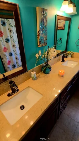 a bedroom with a bed and dresser