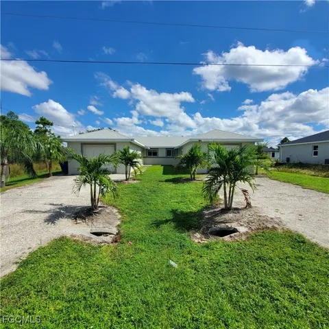 a view of yard with patio