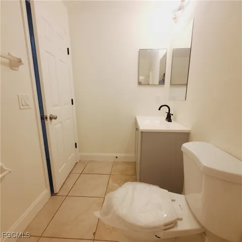 an empty room with a bathroom