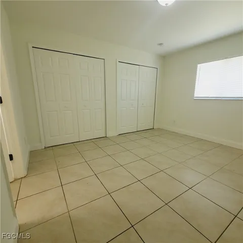 a white toilet sitting next to a bath tub