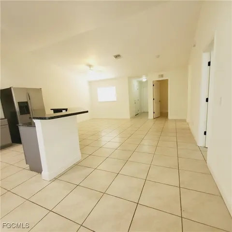 a view of a storage & utility room with a sink