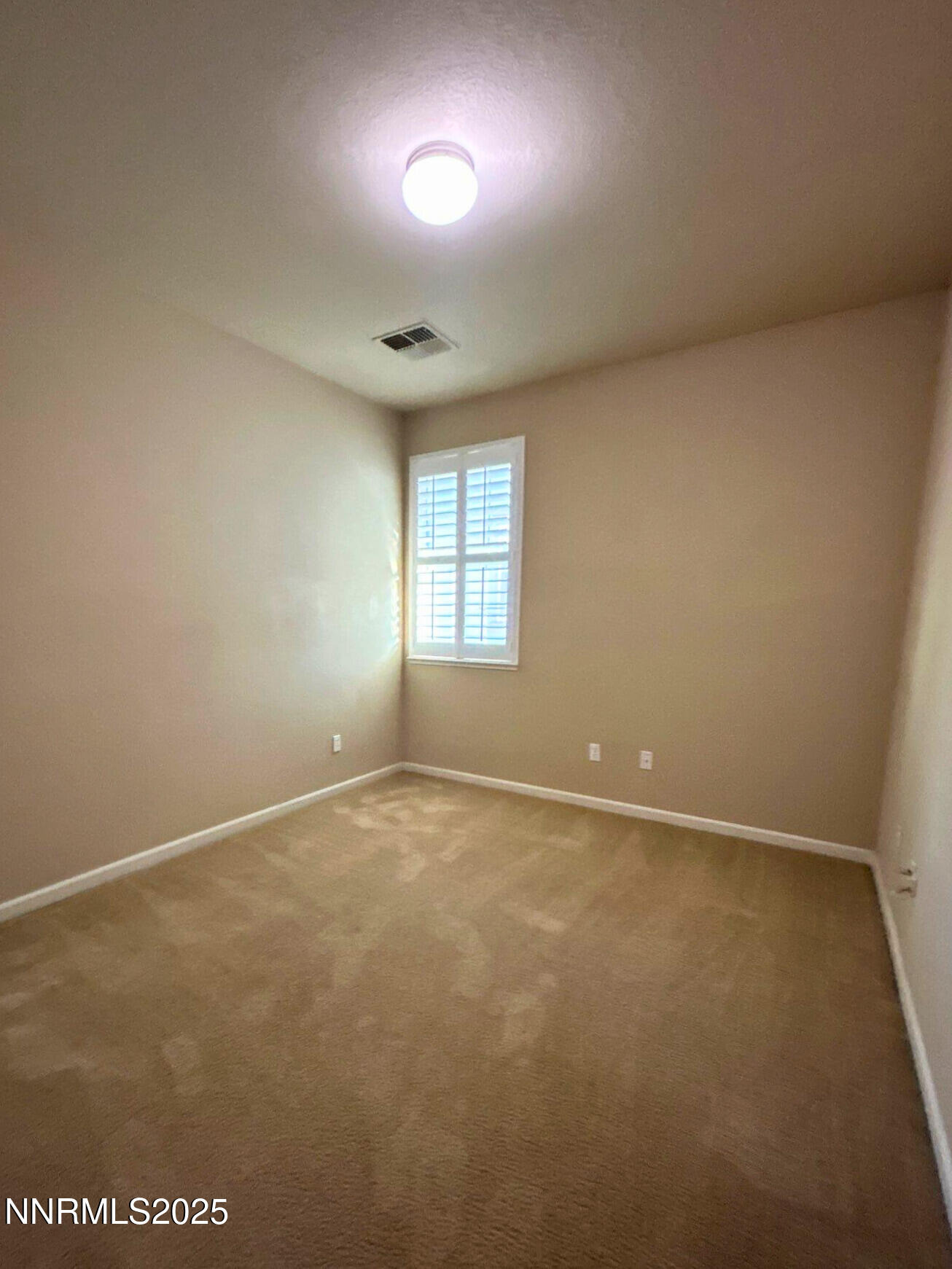 1828 Wind Ranch Road, Unit B Reno, NV 89521 - Photo 17 of 19 an empty room with windows and closet