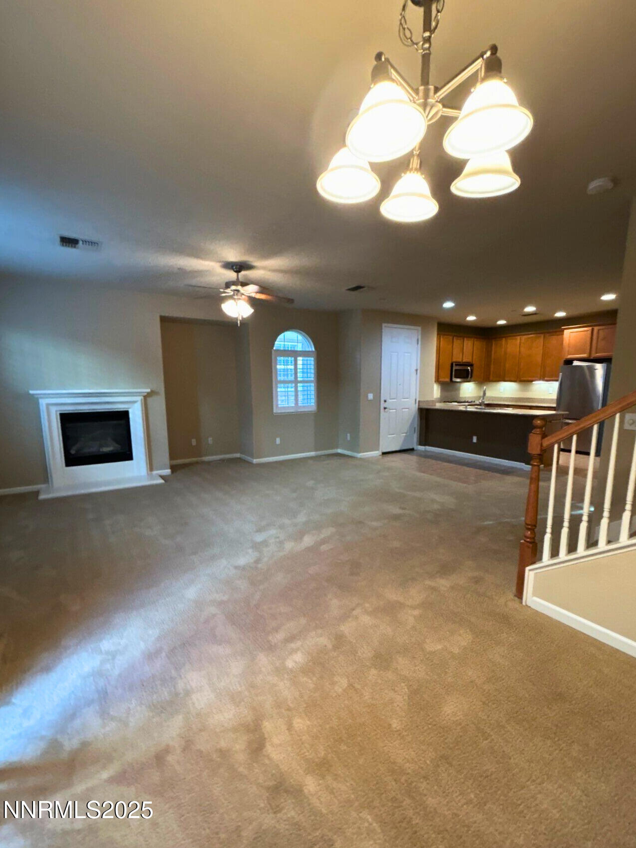 1828 Wind Ranch Road, Unit B Reno, NV 89521 - Photo 3 of 19 a view of a livingroom with a ceiling fan and window