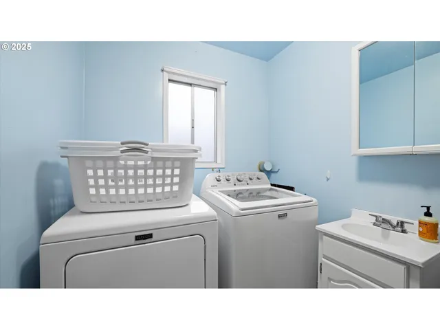 a bathroom with a sink toilet and a mirror