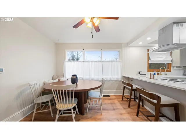 a open kitchen with stainless steel appliances kitchen island a sink dishwasher a stove with refrigerator and cabinets