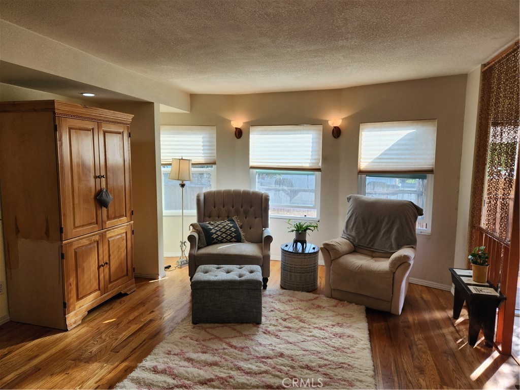 5591 Nelson Street Cypress, CA 90630 - Photo 2 of 5 a living room with furniture and a window