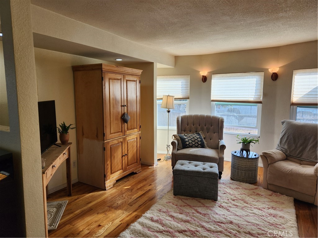 5591 Nelson Street Cypress, CA 90630 - Photo 3 of 5 a living room with furniture and a flat screen tv