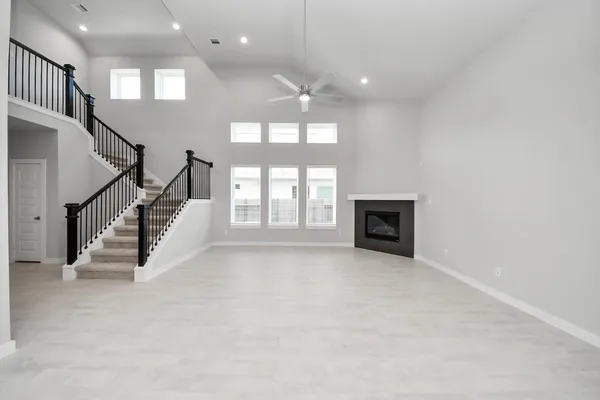 a view of a livingroom with a ceiling fan and window
