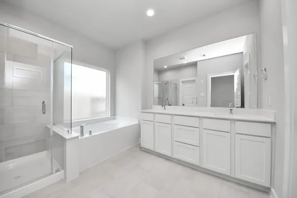 a bathroom with a bathtub and a shower