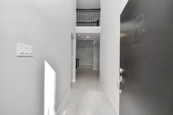 a view of a hallway with entryway