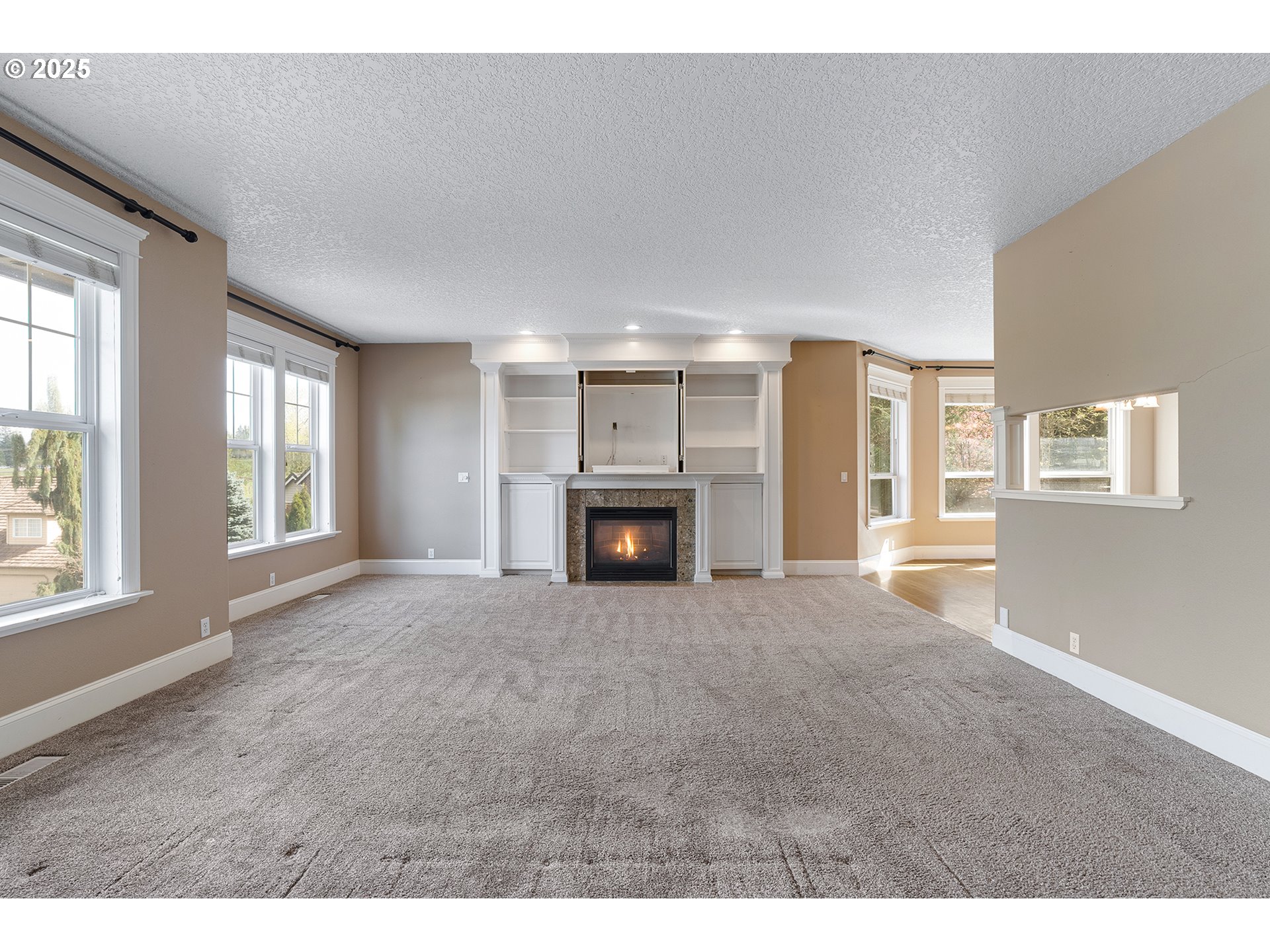 2947 Southeast Maple Place Gresham, OR 97080 - Photo 12 of 46 a view of empty room with a fireplace