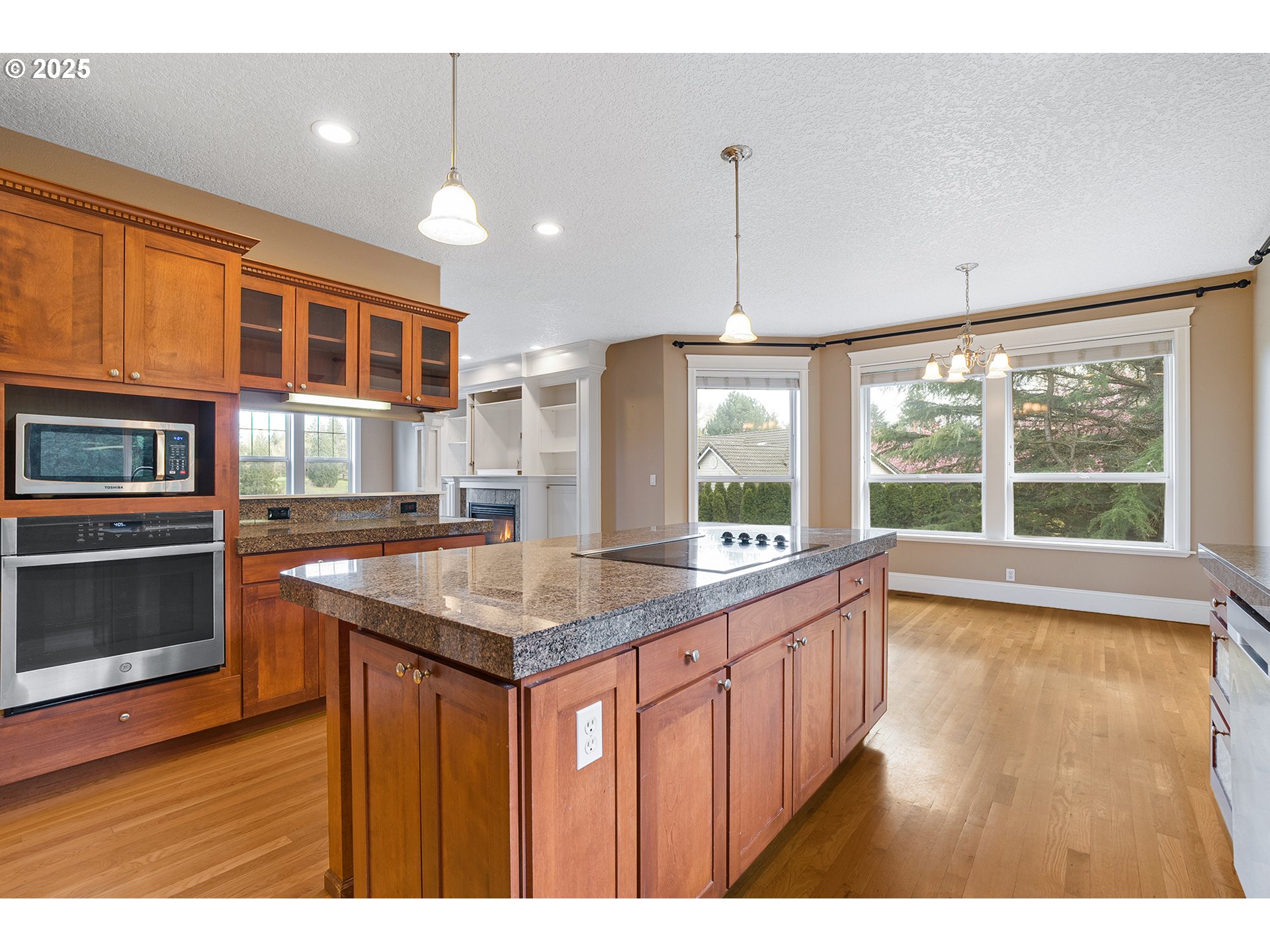 2947 Southeast Maple Place Gresham, OR 97080 - Photo 21 of 46 a kitchen with a stove a sink and wooden floor