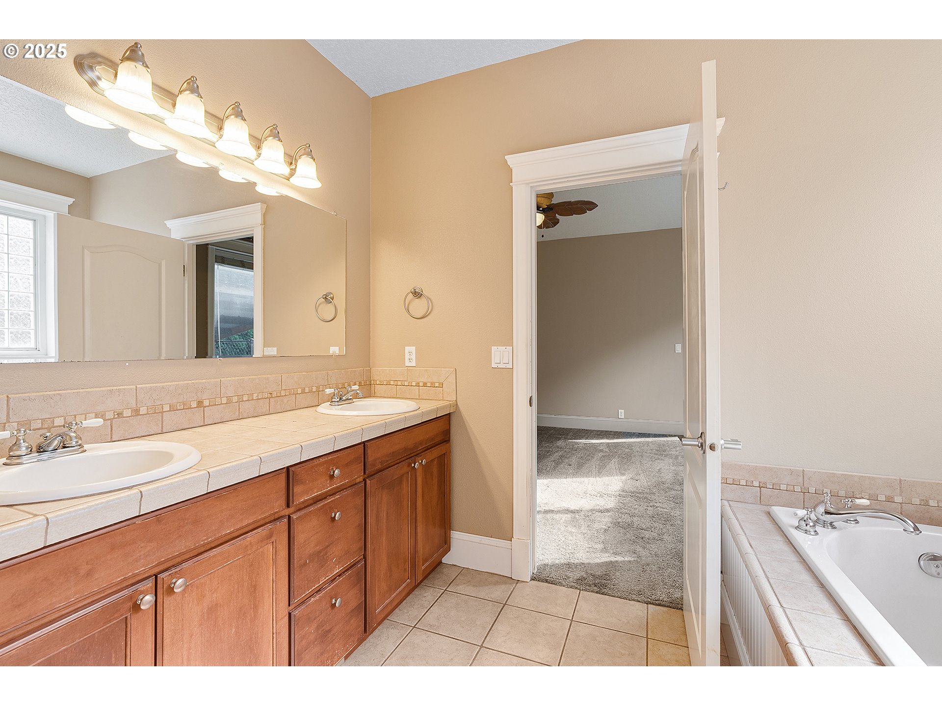 2947 Southeast Maple Place Gresham, OR 97080 - Photo 26 of 46 a bathroom with a sink a vanity and a mirror