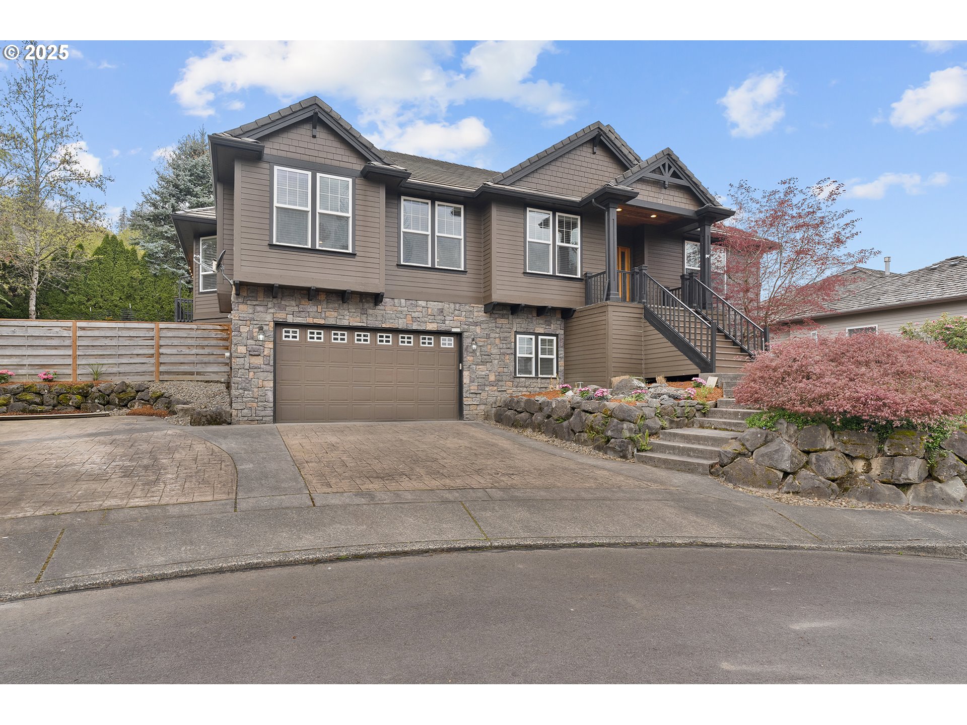 2947 Southeast Maple Place Gresham, OR 97080 - Photo 3 of 46 a front view of a house with a yard and garage