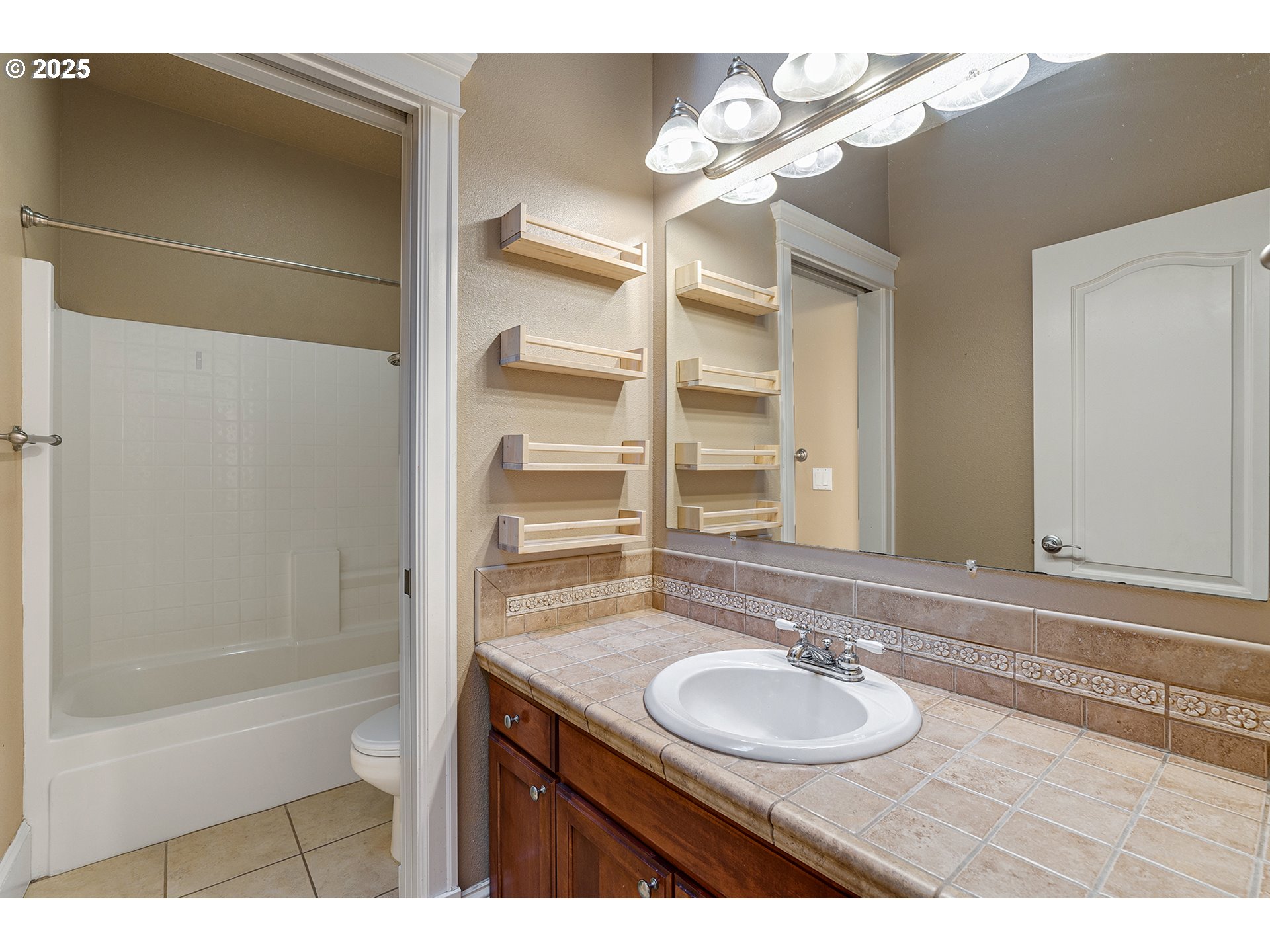 2947 Southeast Maple Place Gresham, OR 97080 - Photo 34 of 46 a bathroom with a sink and a mirror